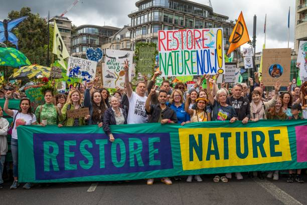 London, UK, Jun 22 2024, Celebrities Chris Packham, Emma Thomson, Dave Vince, Caroline Lucas at the front of the Restore Nature Now March for environmental protection. Organizations present included the RSPB, WWF, National Trust, Extinction Rebellion and others. (Photo by: Andy Soloman/UCG/Universal Images Group via Getty Images)